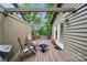 Cozy outdoor deck area with seating, fire pit, small hot tub, and sliding glass door at 18 Shipmaster Ct, Clover, SC 29710