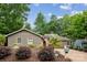 Inviting single-story home with lush landscaping, American flag, and a well-maintained front yard at 18 Shipmaster Ct, Clover, SC 29710