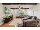 Comfortable living room with a large sectional sofa, ceiling fan, and a mounted television at 18 Shipmaster Ct, Clover, SC 29710
