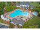 Aerial view of the community pool with ample lounge seating and surrounding amenities at 1855 Second Baxter Xing, Fort Mill, SC 29708