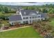Impressive aerial view of Village Hall featuring meticulous landscaping and well-manicured lawn at 1855 Second Baxter Xing, Fort Mill, SC 29708