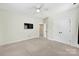 Spacious bedroom with carpet flooring, fan and light fixture, and double door closet at 1855 Second Baxter Xing, Fort Mill, SC 29708