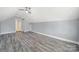 Spacious bonus room features gray flooring and access to other rooms in the house at 1855 Second Baxter Xing, Fort Mill, SC 29708