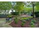 Peaceful community area with benches, fountain, and lush landscaping at 1855 Second Baxter Xing, Fort Mill, SC 29708