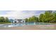 Stunning community pool with blue umbrellas, clear water and nearby lounge seating at 1855 Second Baxter Xing, Fort Mill, SC 29708