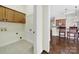 Bright laundry room includes tile floor, built-in cabinets, utility sink, and plenty of room to move at 1855 Second Baxter Xing, Fort Mill, SC 29708