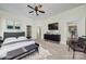 Spacious main bedroom boasts a ceiling fan, ensuite bathroom, and a doorway to the kitchen at 1855 Second Baxter Xing, Fort Mill, SC 29708