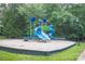 Community playground with blue and green play structure with slides, climbing area, and swings at 1855 Second Baxter Xing, Fort Mill, SC 29708