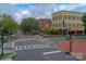 Street view of Baxter Village, showcasing pedestrian-friendly walkways and colorful buildings at 1855 Second Baxter Xing, Fort Mill, SC 29708