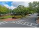 Scenic street view with lush green trees, sidewalks, and well-maintained landscaping at 1855 Second Baxter Xing, Fort Mill, SC 29708