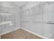 This walk-in closet includes ample shelving and storage space with carpet flooring at 1855 Second Baxter Xing, Fort Mill, SC 29708
