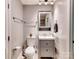 This half bathroom has a storage vanity with granite countertops, a modern sink, and tile floors at 1904 Lark Ln, Stanley, NC 28164
