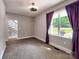 Neutral bedroom featuring carpeting, a window with curtains, and ample natural light at 1904 Lark Ln, Stanley, NC 28164