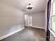 Neutral bedroom featuring carpeting, a ceiling fan, and a window with curtains at 1904 Lark Ln, Stanley, NC 28164