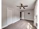 This bedroom features plush carpet, a ceiling fan, and neutral paint, offering a cozy retreat at 1904 Lark Ln, Stanley, NC 28164