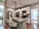 This kitchen has white cabinets, stainless steel appliances, granite countertops, and bar seating at 1904 Lark Ln, Stanley, NC 28164