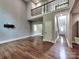 Great room displaying hardwood floors, a wrought iron staircase, and high ceilings at 1904 Lark Ln, Stanley, NC 28164