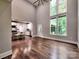 This great room features hardwood floors, high ceilings, a kitchen, and tons of natural light at 1904 Lark Ln, Stanley, NC 28164
