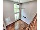 Spacious living room with high ceilings, large windows, and wood floors at 1904 Lark Ln, Stanley, NC 28164