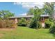 Home's rear exterior features an lawn, trees, and bushes at 205 Dogwood Ln, Dallas, NC 28034