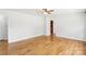 Spacious bedroom featuring hardwood floors, ample natural light, and a ceiling fan at 205 Dogwood Ln, Dallas, NC 28034