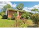 Brick home with mature shrubs, trees, and lawn at 205 Dogwood Ln, Dallas, NC 28034