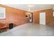 Brick wall features in the two-car garage with epoxy floor plus window and door to the outside at 205 Dogwood Ln, Dallas, NC 28034