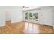 Spacious living room features hardwood floors and a large window offering a picturesque view at 205 Dogwood Ln, Dallas, NC 28034