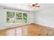 Bright living room features hardwood floors and a large window offering a picturesque view at 205 Dogwood Ln, Dallas, NC 28034