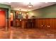 Finished basement with a wet bar, wainscoting, and stained concrete floors at 2101 Congress Ct, Kannapolis, NC 28083