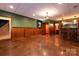Finished basement with a wet bar, wainscoting, and stained concrete floors at 2101 Congress Ct, Kannapolis, NC 28083