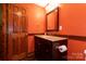 Stylish bathroom featuring granite countertop, dark wood cabinetry, and wood door at 2101 Congress Ct, Kannapolis, NC 28083