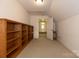 Bonus room featuring built-in bookshelves and access to another room at 2101 Congress Ct, Kannapolis, NC 28083