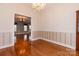 Cozy dining room featuring chair rail, hardwood floors, and adjacent living room at 2101 Congress Ct, Kannapolis, NC 28083