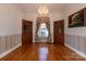 Elegant dining room with hardwood floors, chandelier, and built-in cabinets at 2101 Congress Ct, Kannapolis, NC 28083