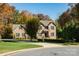 Lovely brick home with green shutters, mature trees and a well-maintained lawn at 2101 Congress Ct, Kannapolis, NC 28083