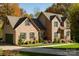 Charming brick two-story home with lush landscaping and a well-manicured lawn at 2101 Congress Ct, Kannapolis, NC 28083