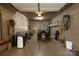 Well-lit garage with tools, shelving, and outdoor equipment for yard maintenance at 2101 Congress Ct, Kannapolis, NC 28083