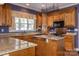 Gourmet kitchen with custom cabinets, granite countertops, and stainless steel appliances at 2101 Congress Ct, Kannapolis, NC 28083