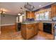 Traditional kitchen with granite countertops, tile floor, kitchen island, and stainless steel dishwasher at 2101 Congress Ct, Kannapolis, NC 28083
