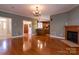 Inviting living room with fireplace, hardwood floors, and views into the kitchen at 2101 Congress Ct, Kannapolis, NC 28083