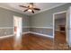 Spacious living room with hardwood floors, white trim, and a ceiling fan at 2101 Congress Ct, Kannapolis, NC 28083