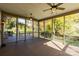 Spacious screened back porch with multiple ceiling fans and beautiful exterior views at 2101 Congress Ct, Kannapolis, NC 28083