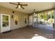 View of an open-air screened in porch, with dual ceiling fans, and backyard access at 2101 Congress Ct, Kannapolis, NC 28083
