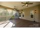 Spacious screened porch with outdoor ceiling fans, wood floors, and exterior home access at 2101 Congress Ct, Kannapolis, NC 28083