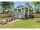A spacious backyard with a stone seating area, offers a serene setting for outdoor enjoyment and gatherings at 222 N Weldon St, Gastonia, NC 28052