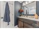 Bathroom featuring modern wooden vanity, mirror and elegant decor at 222 N Weldon St, Gastonia, NC 28052