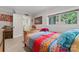 A colorful bedroom featuring a unique, bright comforter and natural light at 222 N Weldon St, Gastonia, NC 28052
