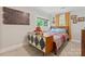 Bright bedroom featuring warm lighting, a USA map and a wooden dresser at 222 N Weldon St, Gastonia, NC 28052