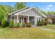Attractive home showcasing manicured landscaping and a welcoming front porch at 222 N Weldon St, Gastonia, NC 28052